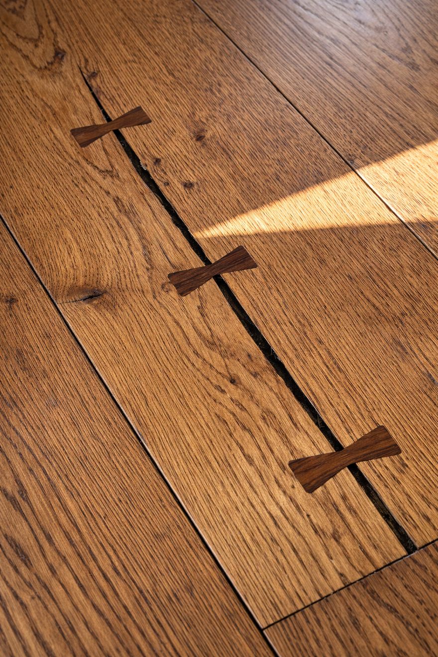 Hand-cut bow-tie inlay detail